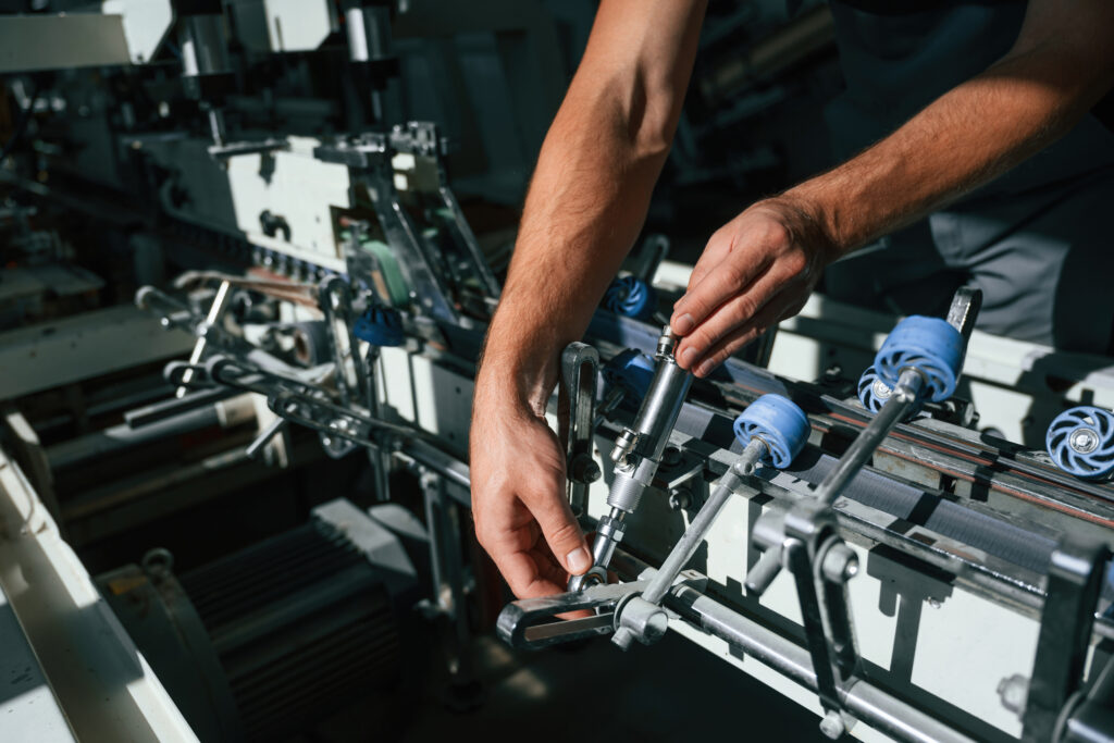 hands are adjusting the machine handsome man is w 2025 03 18 22 01 38 utc